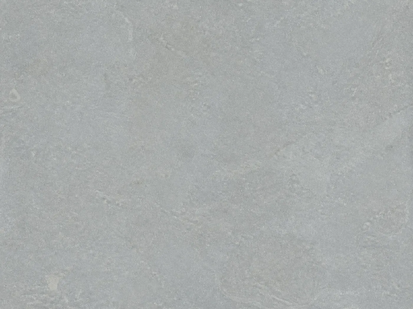 A flat honed tile of blue-grey Shahabad limestone, showing its even colour and fine natural surface