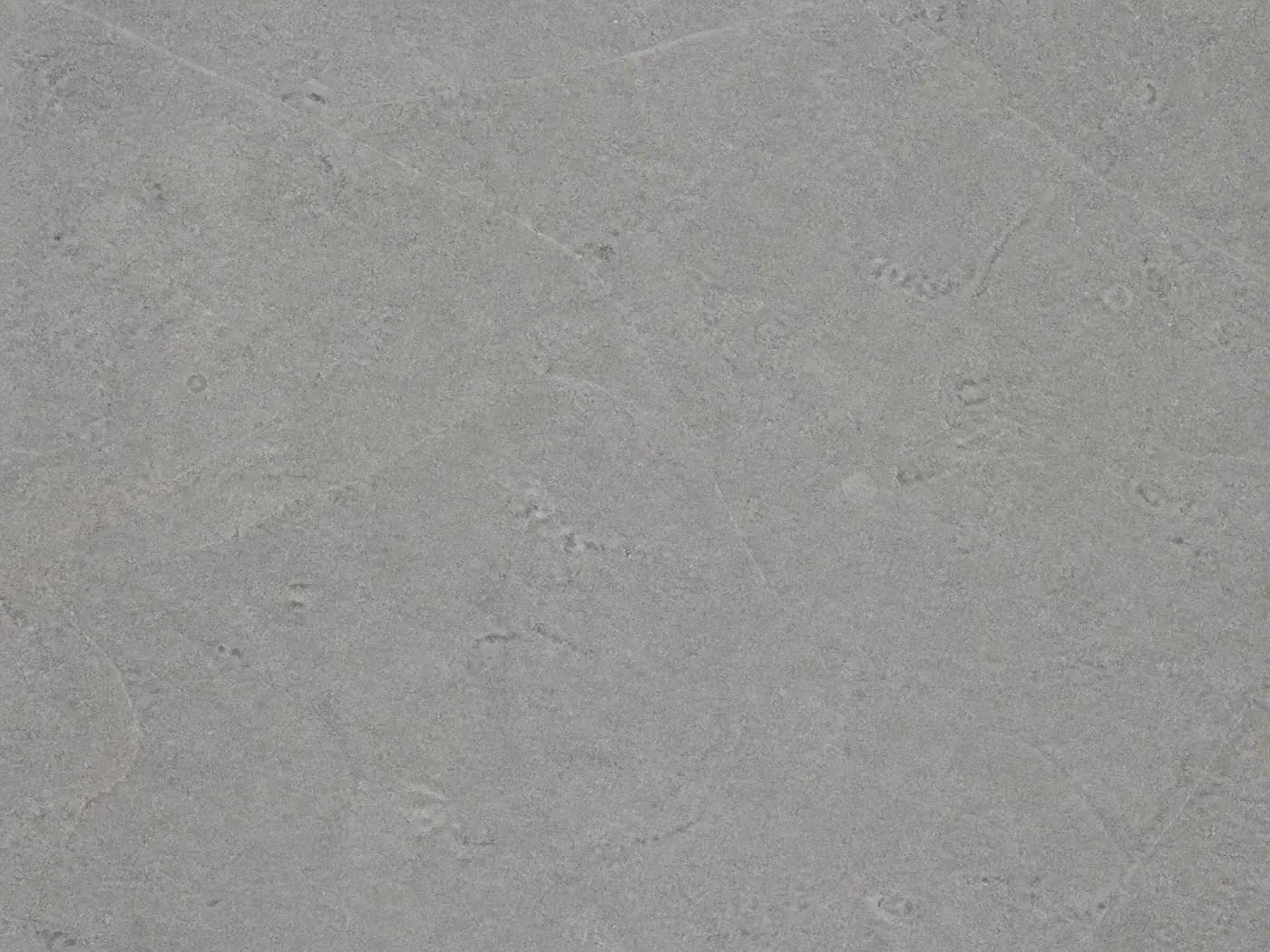 A flat honed tile of cool mid-grey Shahabad limestone, showing its even colour and fine natural surface